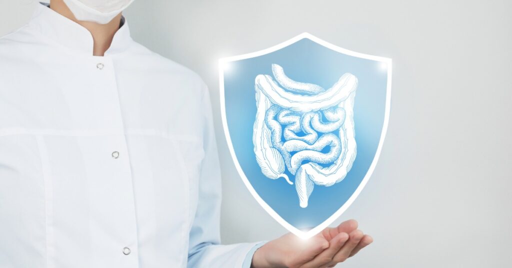 A shield graphic with gut flora icons inside